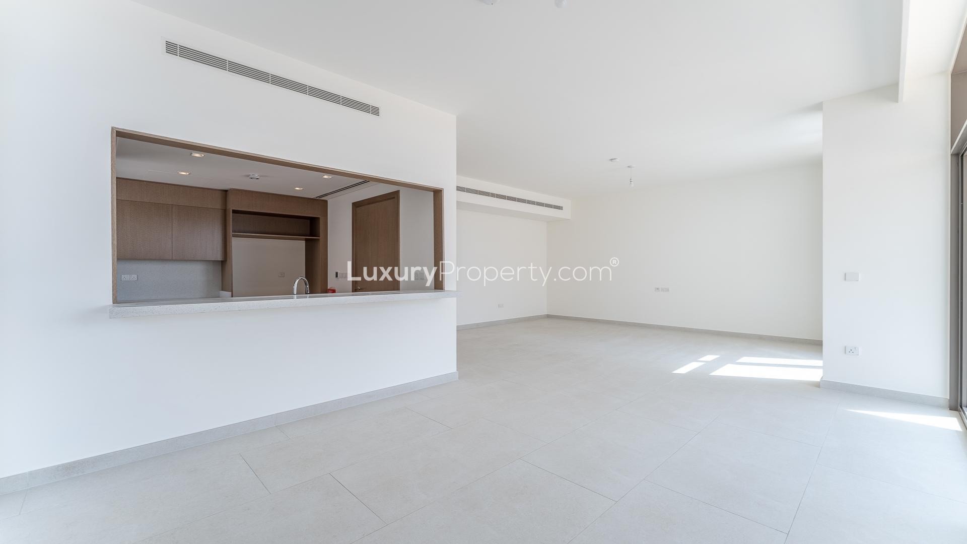 Modern townhouse exterior with wrap balcony in Tilal Al Furjan, Al Furjan community