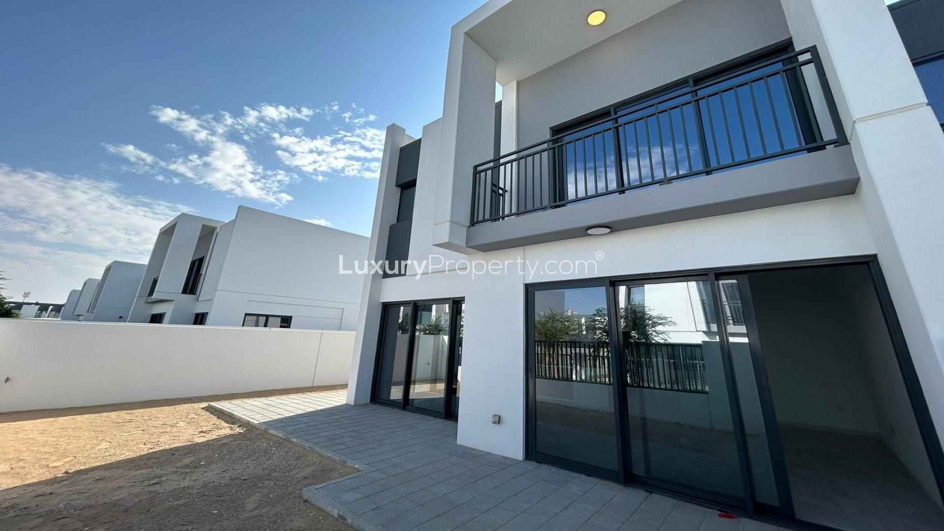Modern kitchen with island and large windows in La Rosa, Villanova townhouse