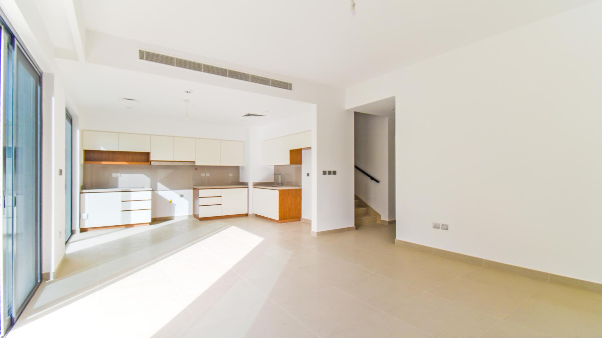 Exterior view of modern townhouse in Arabian Ranches 2, Camelia, with parking space