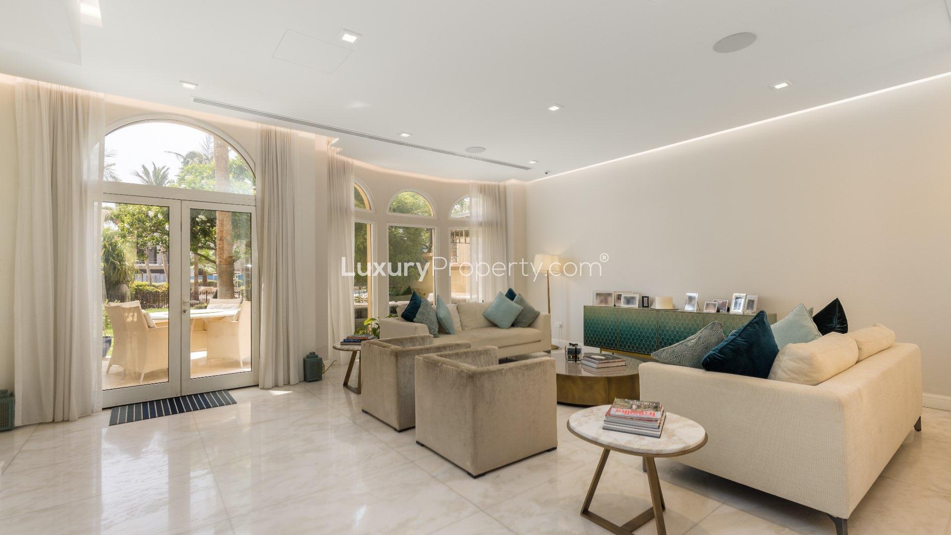 Luxurious living room in Canal Cove Villa, Palm Jumeirah, with elegant furnishings and decor