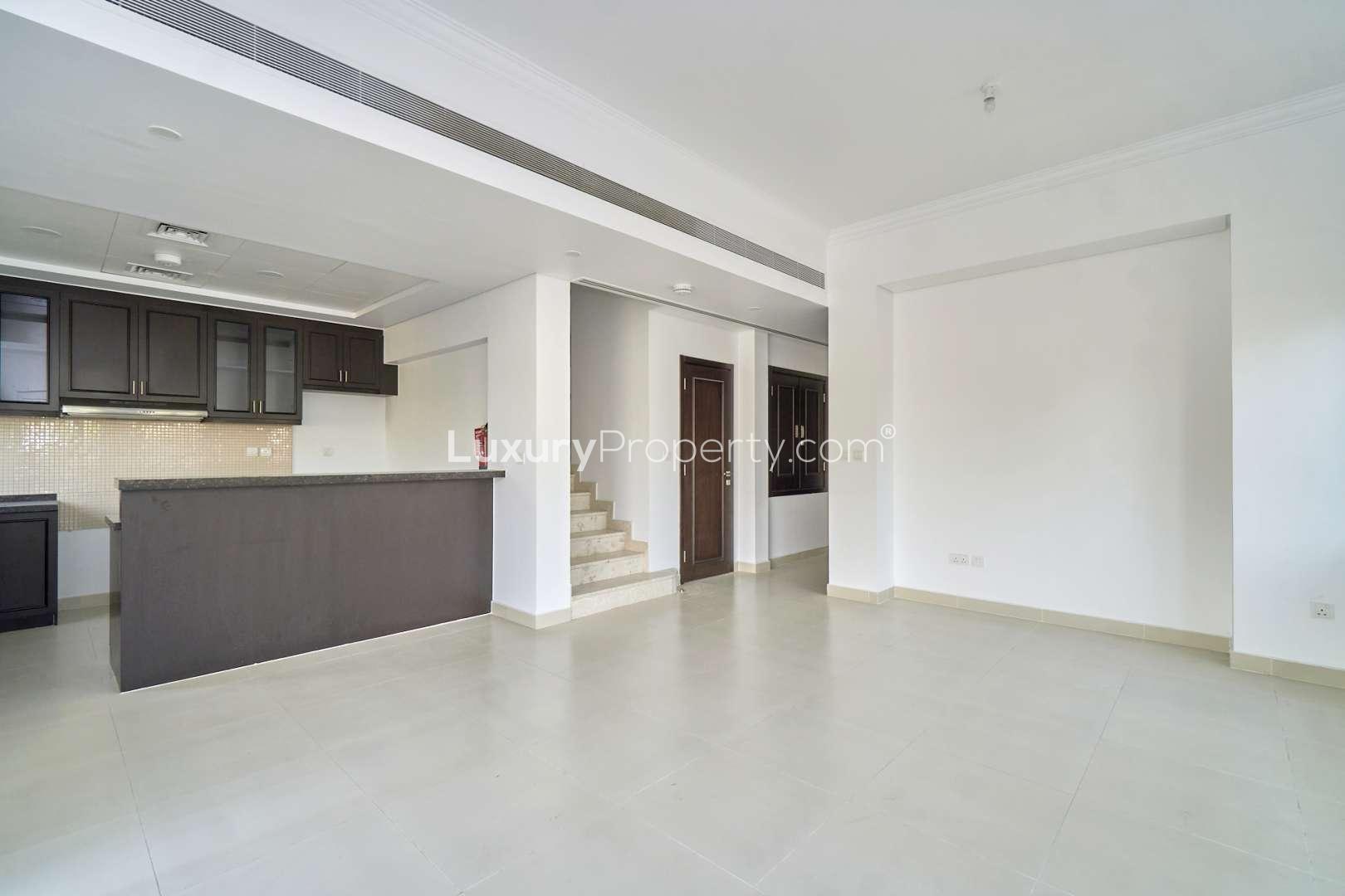 Modern kitchen in 4-bedroom townhouse, Casa Viva, Serena, with dark cabinets and spacious counters