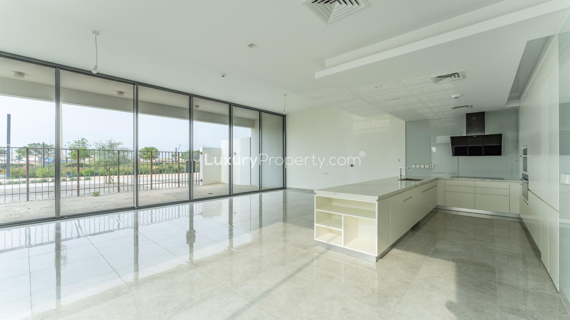 Modern kitchen and spacious living area in District One 4-bedroom villa, Dubai