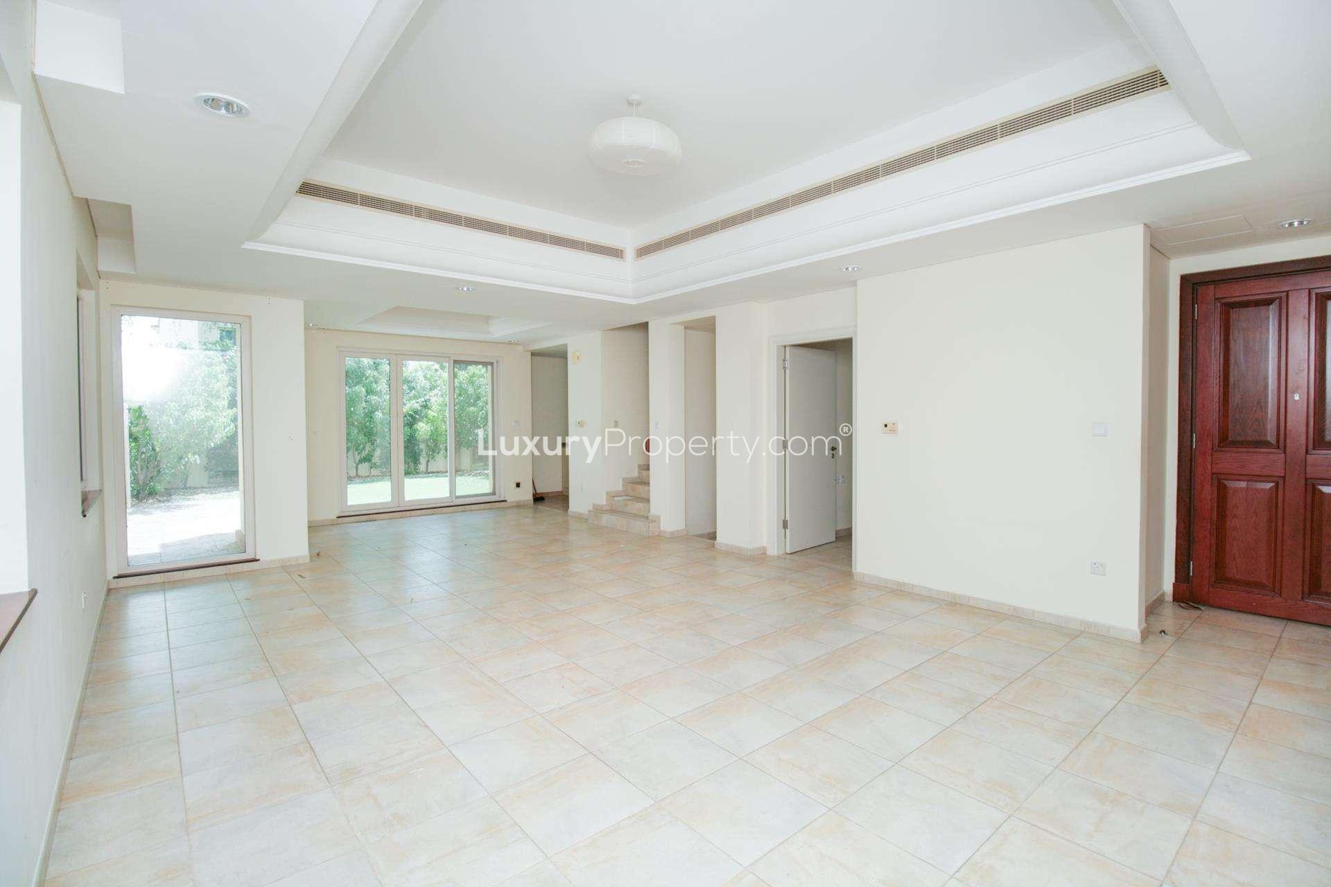 Empty room with tiled floor and large window in Estella townhouse, Victory Heights