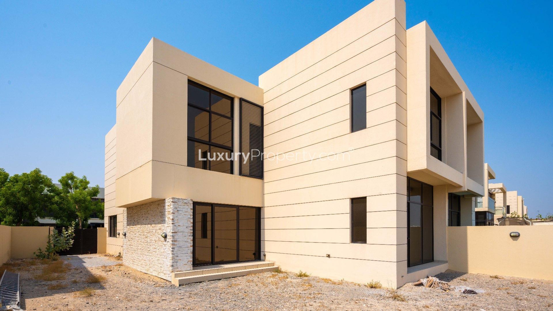 Spacious 4-bedroom townhouse exterior in Damac Hills, The Field community, for rent