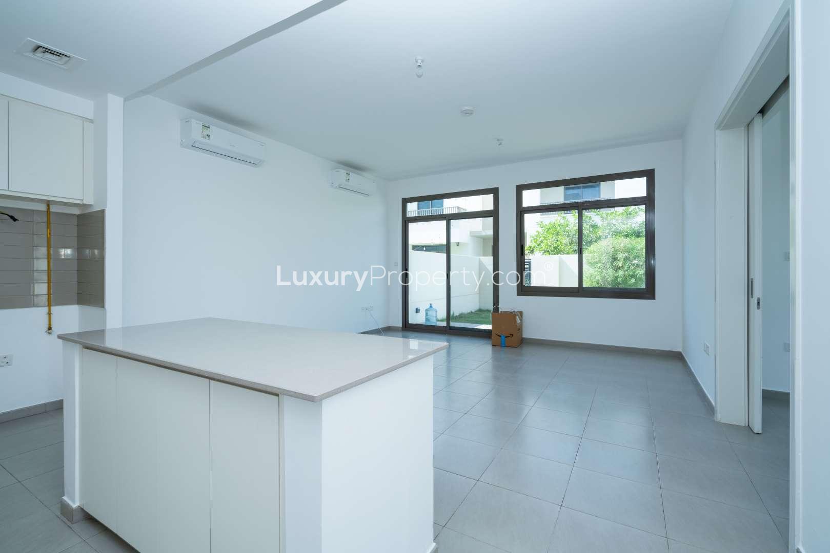 Corner townhouse with green lawn in Hayat, Town Square, available for rent