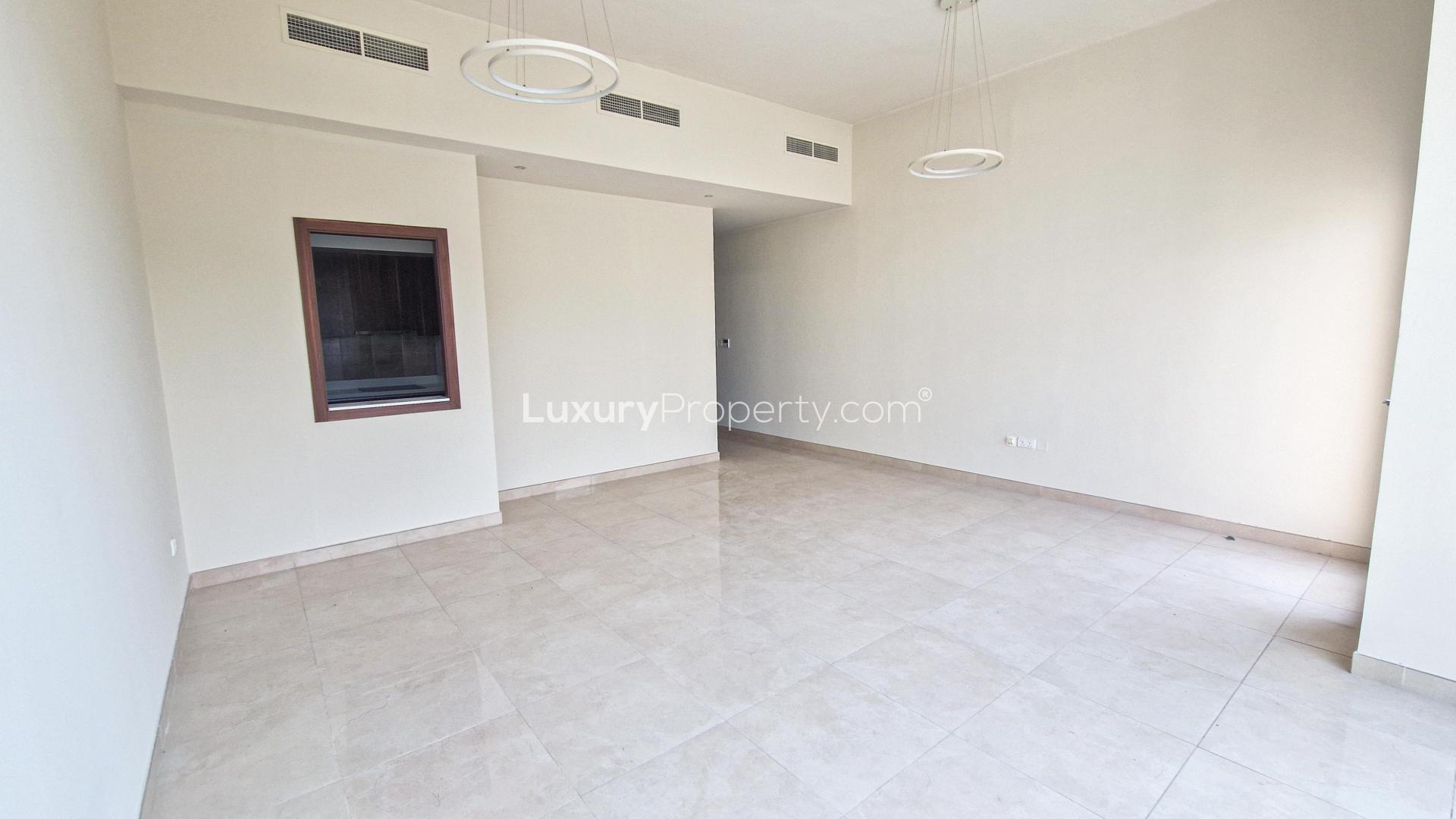 Modern living room with large windows in Murano townhouse, Al Furjan