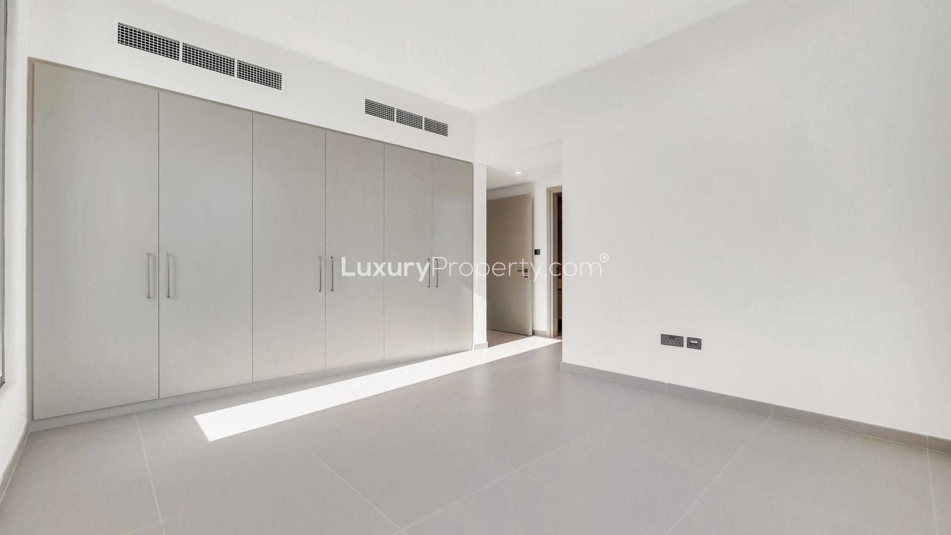 Bright living room with large windows in Arabian Ranches 3 villa, Dubai