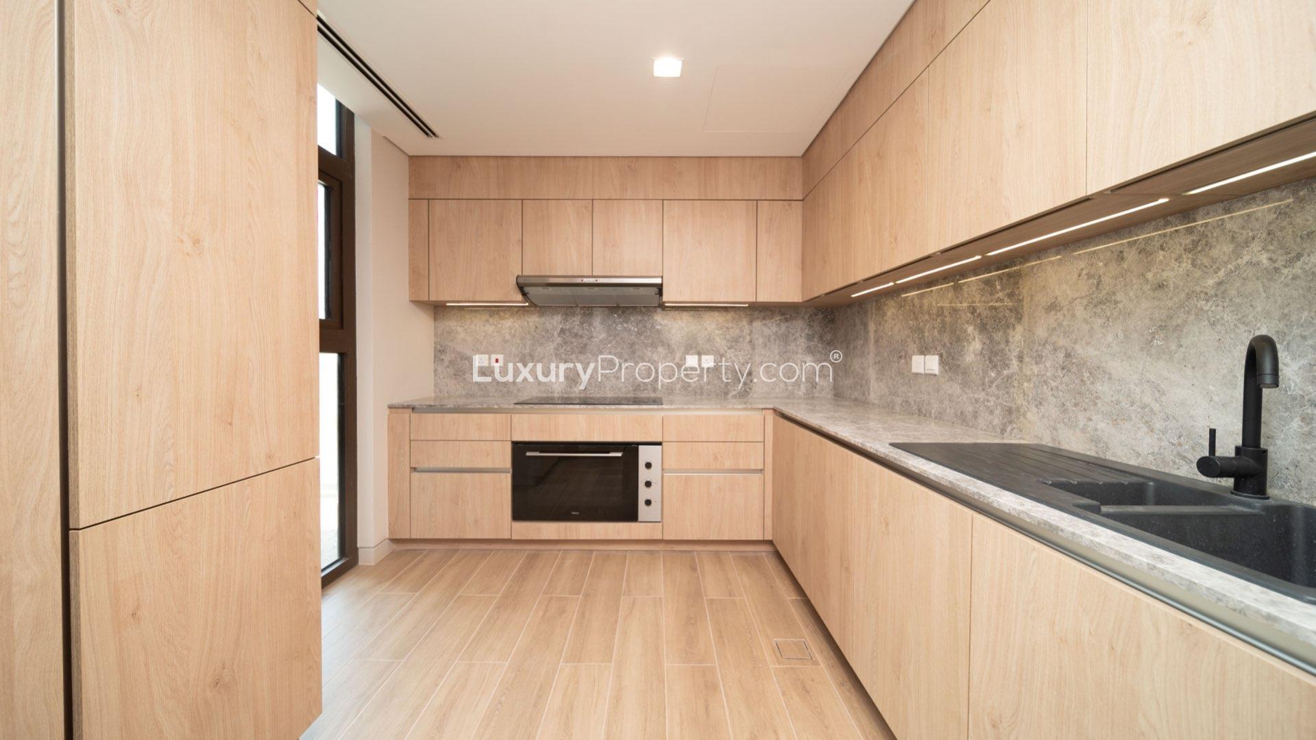 Spacious living area with large windows in Jumeirah Bay Island townhouse for rent