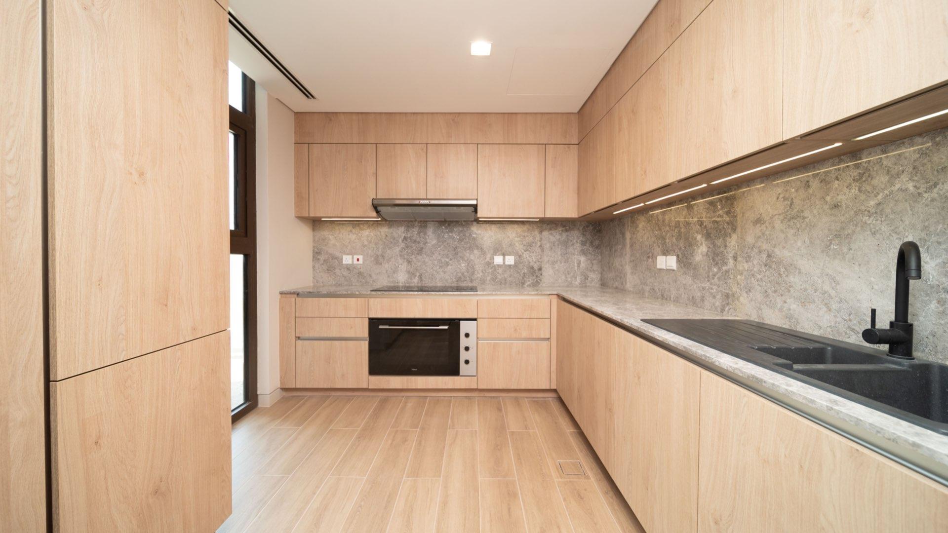 Spacious living area with large windows in Jumeirah Bay Island townhouse for rent