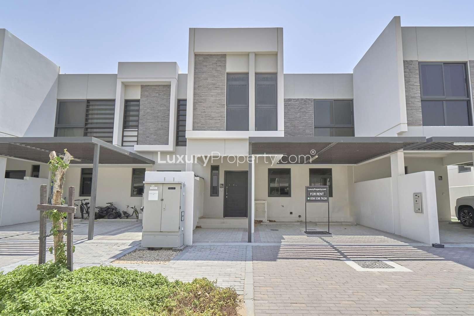 Exterior view of spacious townhouse patio in Juniper, Damac Hills 2, for rent