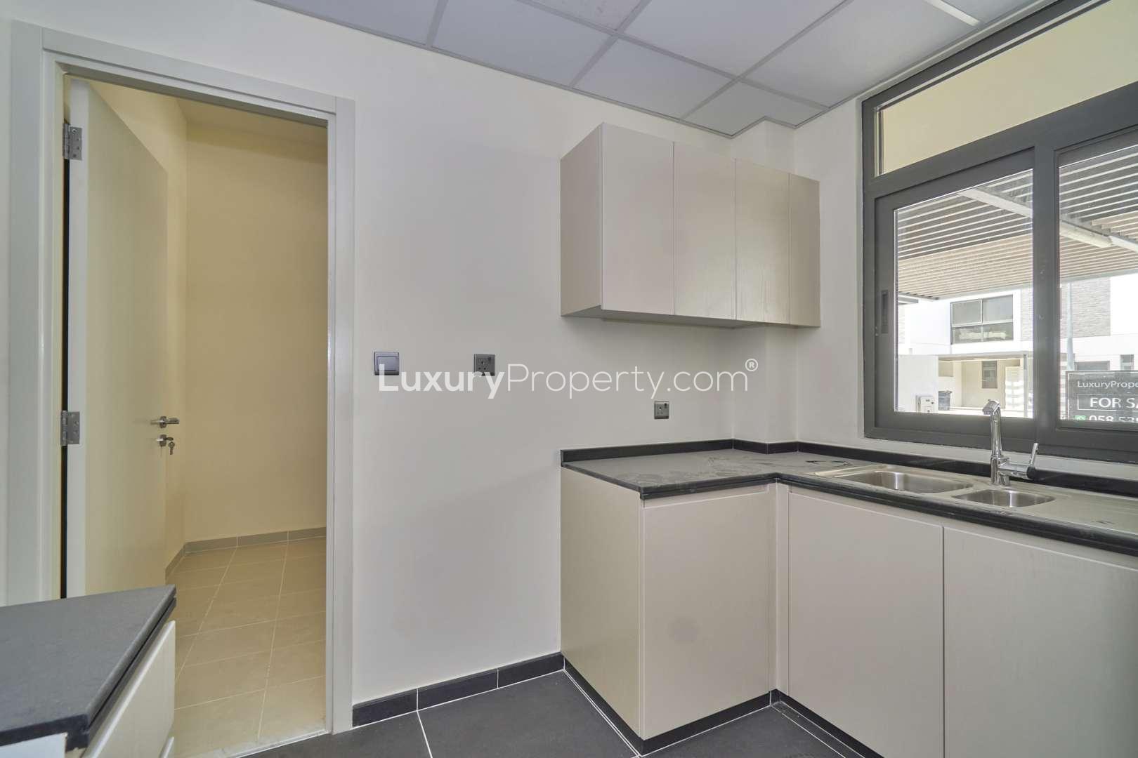 Modern 4-bedroom townhouse exterior for rent in Juniper, Damac Hills 2, Akoya community