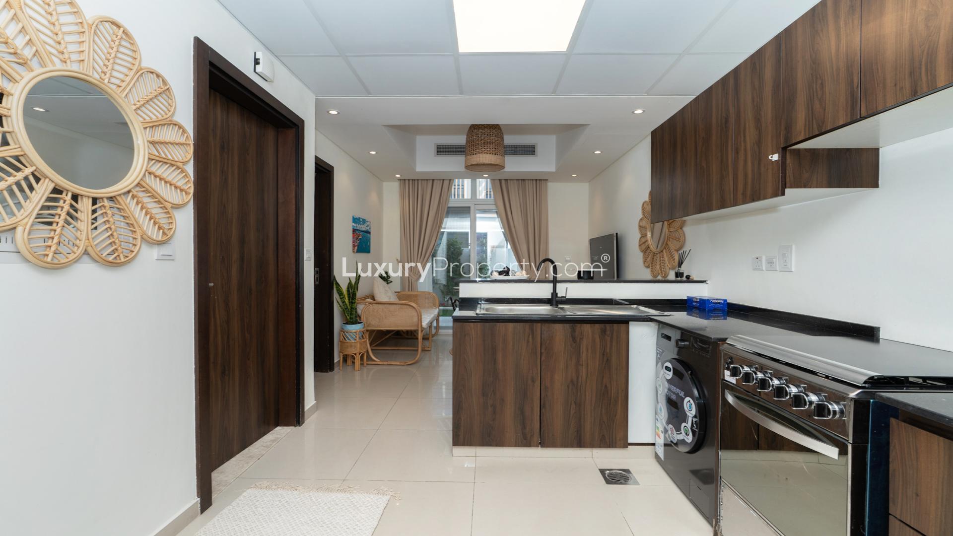 Modern kitchen in fully furnished 4-bedroom townhouse, Victoria, Damac Hills 2, Dubai