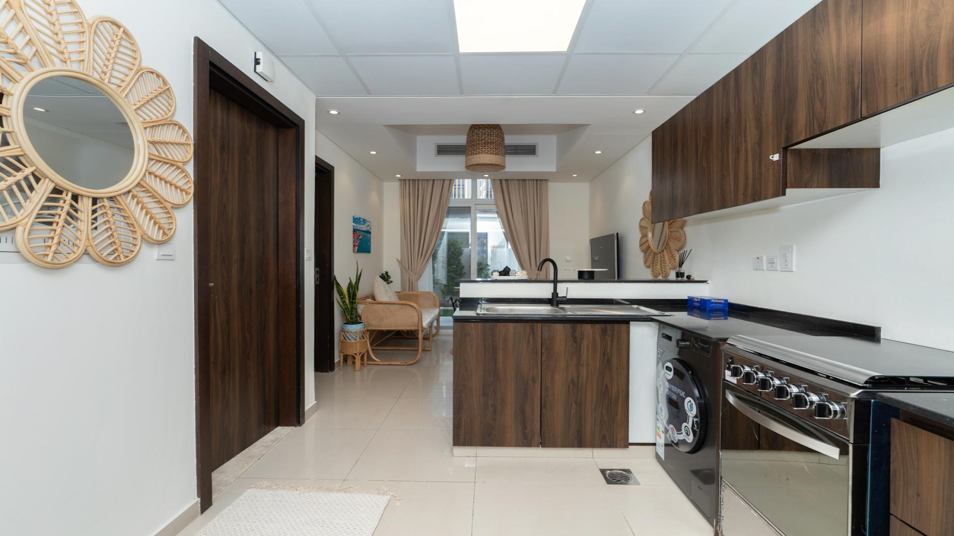 Modern kitchen in fully furnished 4-bedroom townhouse, Victoria, Damac Hills 2, Dubai