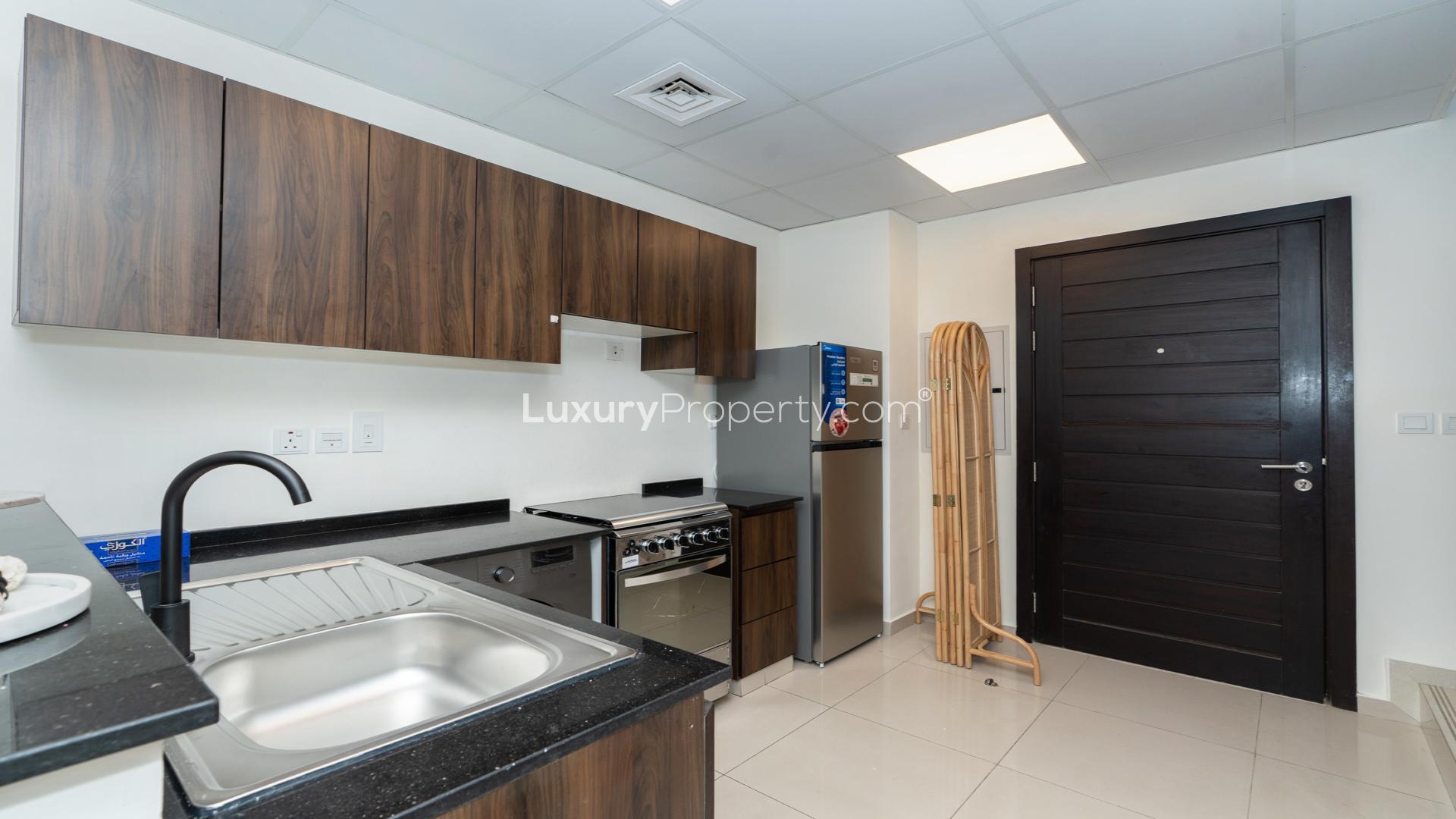 Fully furnished kitchen in 4-bedroom townhouse, Victoria, Damac Hills 2, Dubai