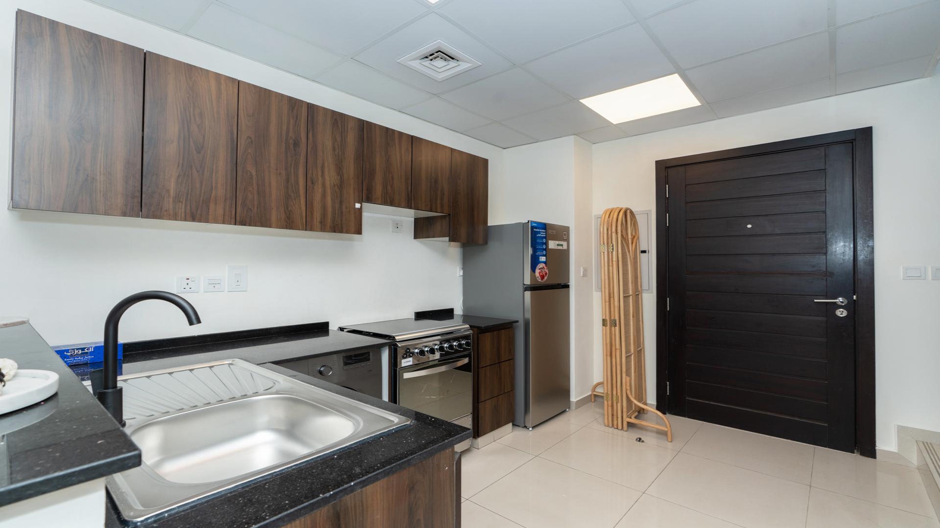 Fully furnished kitchen in 4-bedroom townhouse, Victoria, Damac Hills 2, Dubai