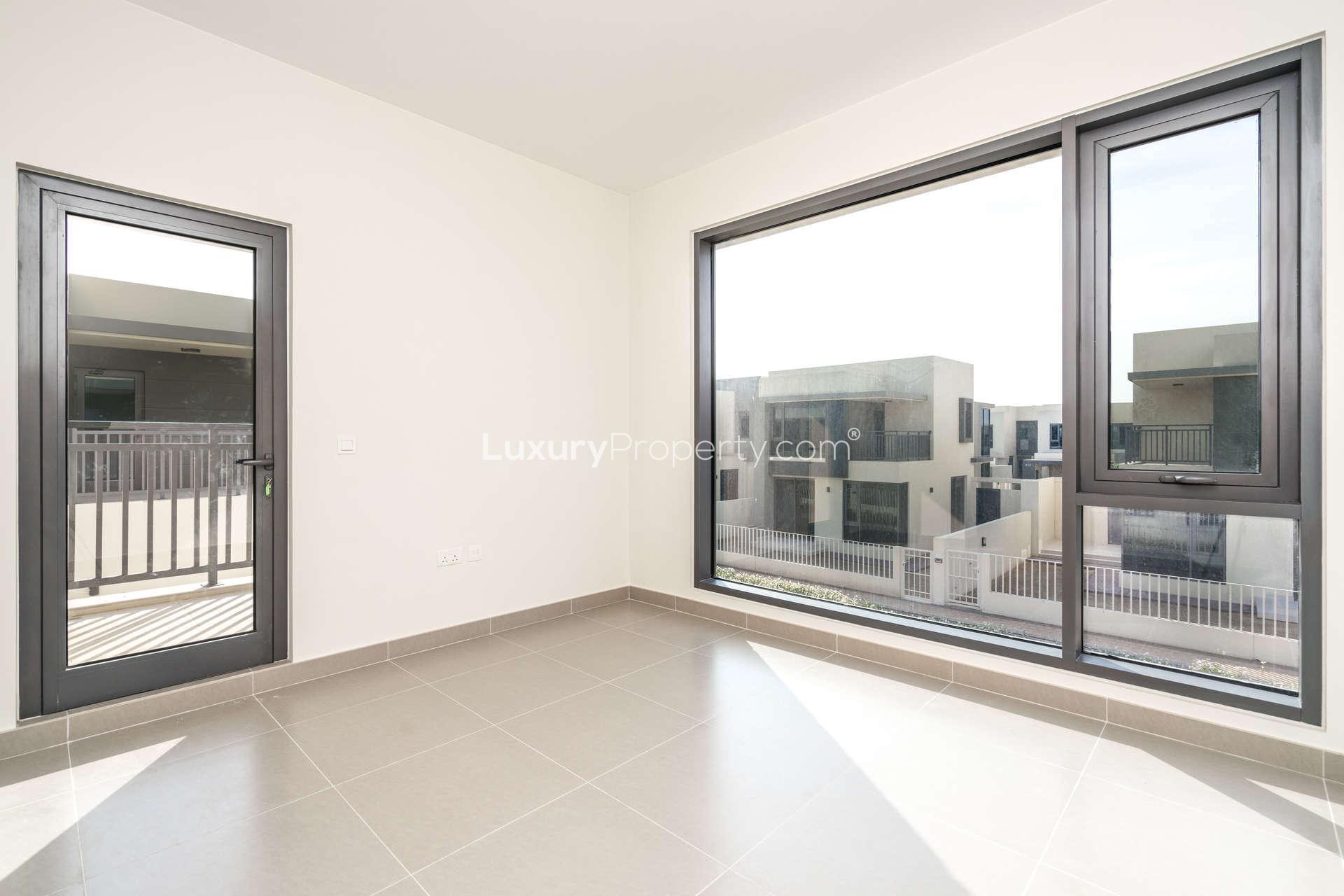 Four-bedroom townhouse exterior in Maple, Dubai Hills Estate, with modern design and greenery