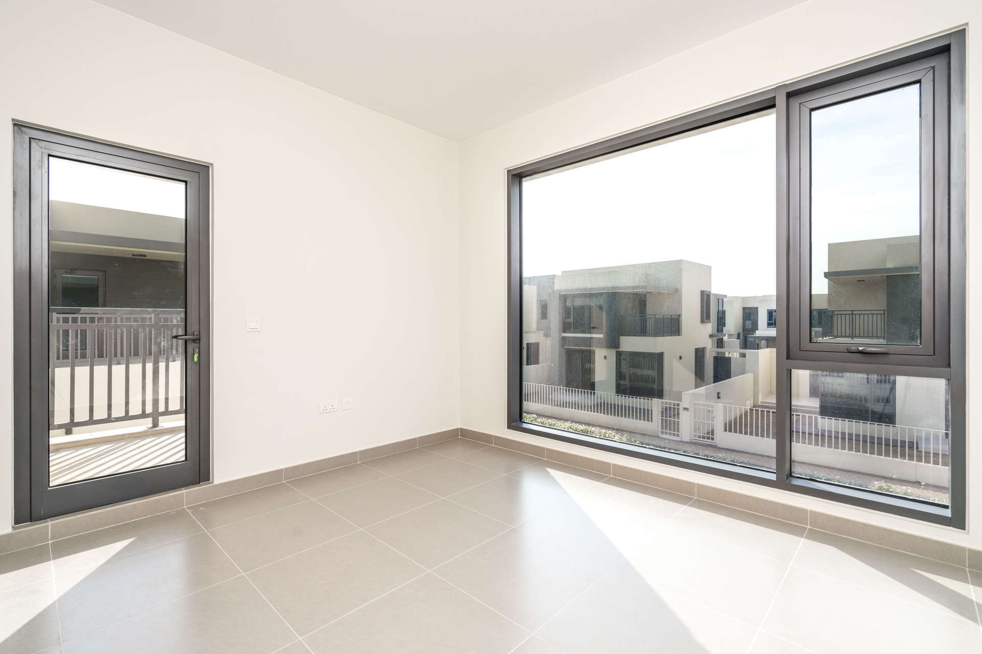 Four-bedroom townhouse exterior in Maple, Dubai Hills Estate, with modern design and greenery