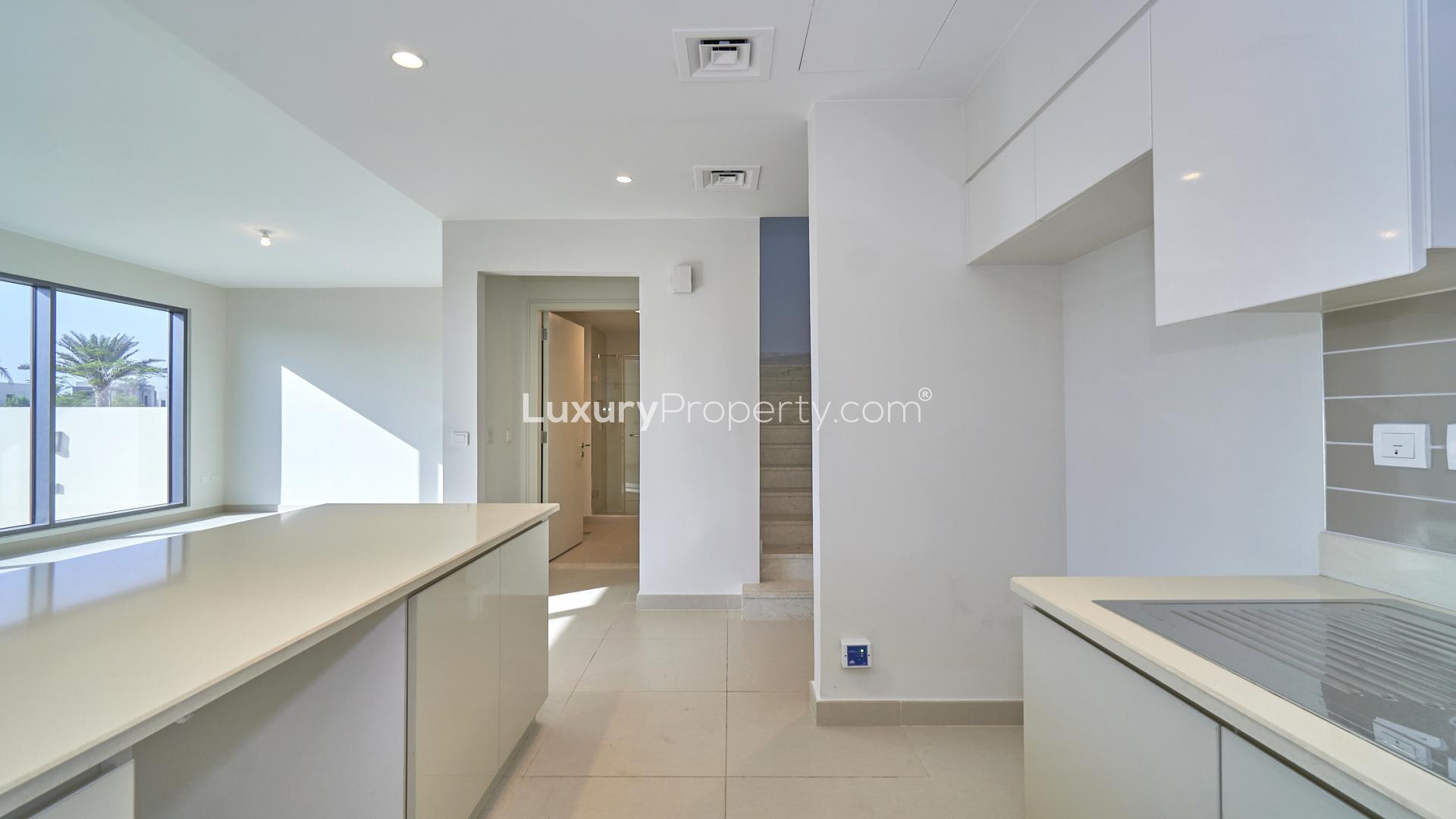 Modern kitchen and living area in Dubai Hills Estate townhouse for rent, Maple community