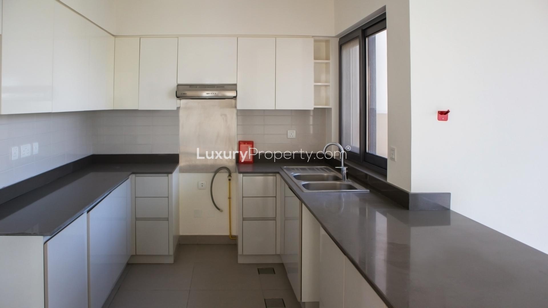 "Bright staircase in 4-bedroom villa, Maple at Dubai Hills Estate, for rent LP12064.",Empty room with large window overlooking camel racing track in Dubai Hills Estate