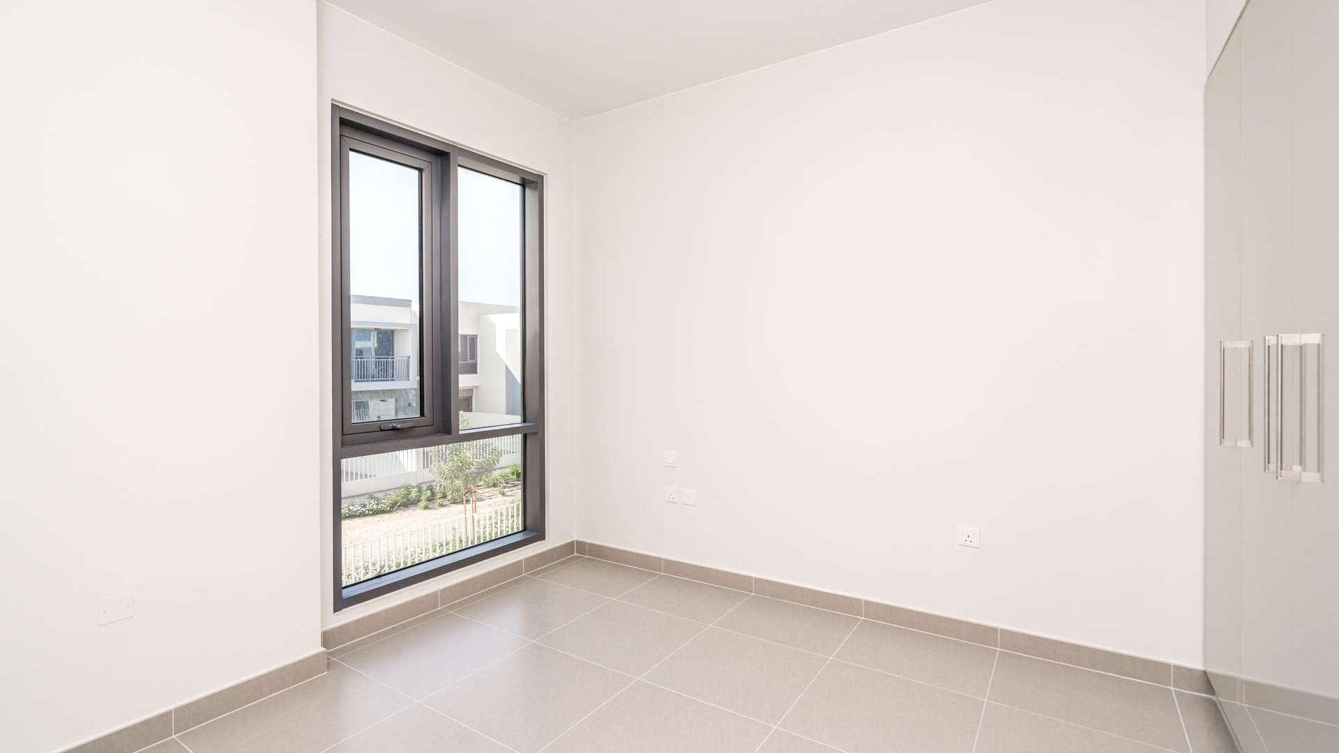 Bright bedroom with large window in Maple at Dubai Hills Estate villa for rent