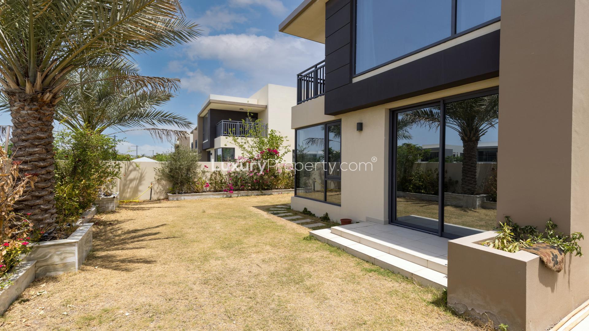 Bright living room with large windows, garden view, in Dubai Hills Estate townhouse for rent