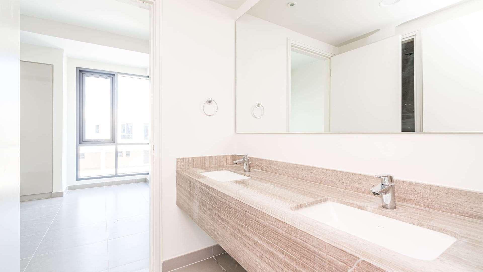 Modern kitchen with white cabinets in Maple 1 townhouse, Dubai Hills Estate