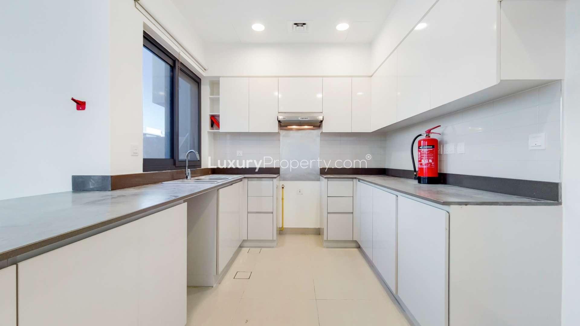 Modern living room with large windows in Dubai Hills Estate townhouse for rent