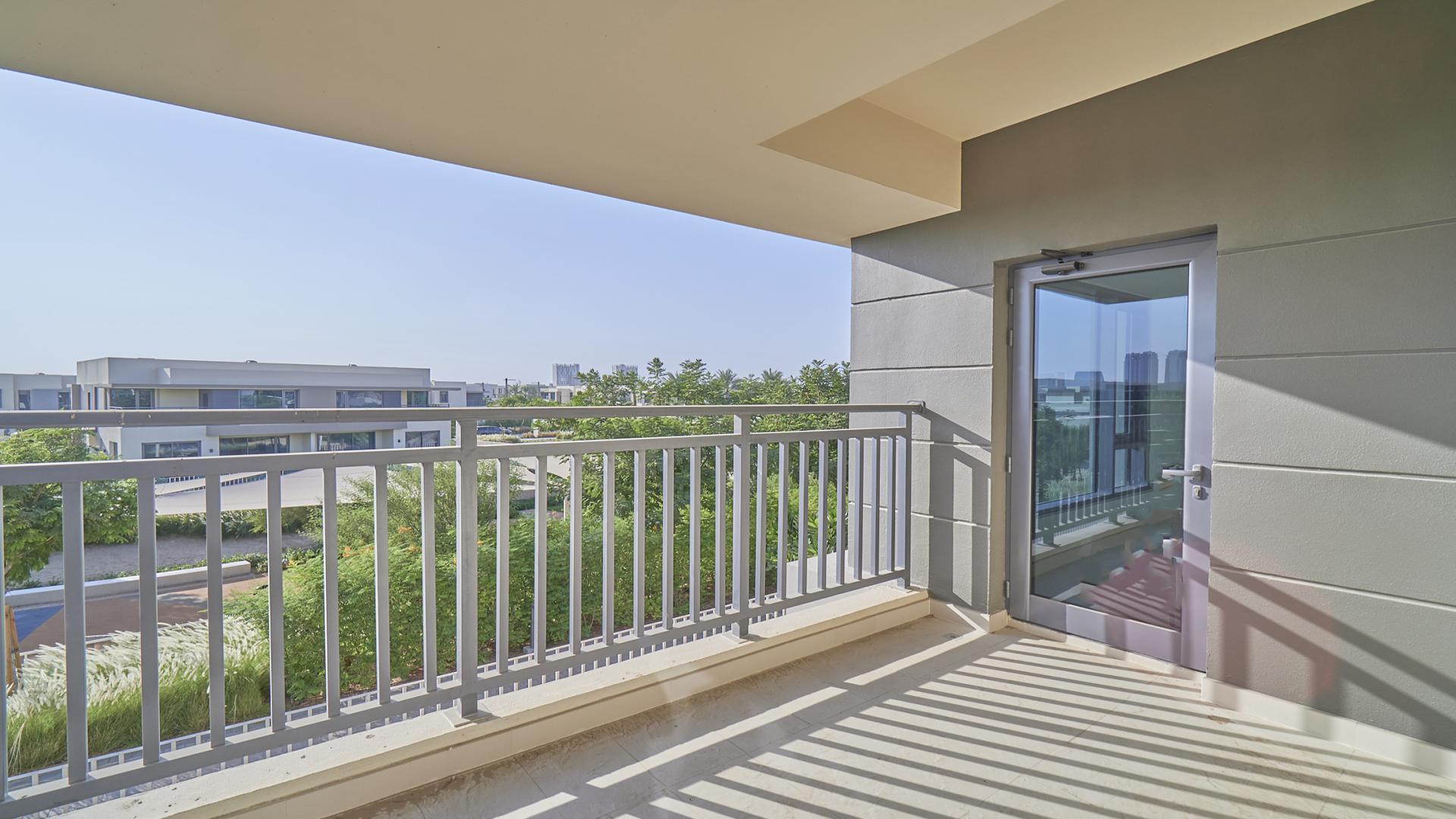 "Balcony view of townhouse in Maple at Dubai Hills Estate, available for rent.",Bright, empty room with large window in Maple townhouse, Dubai Hills Estate