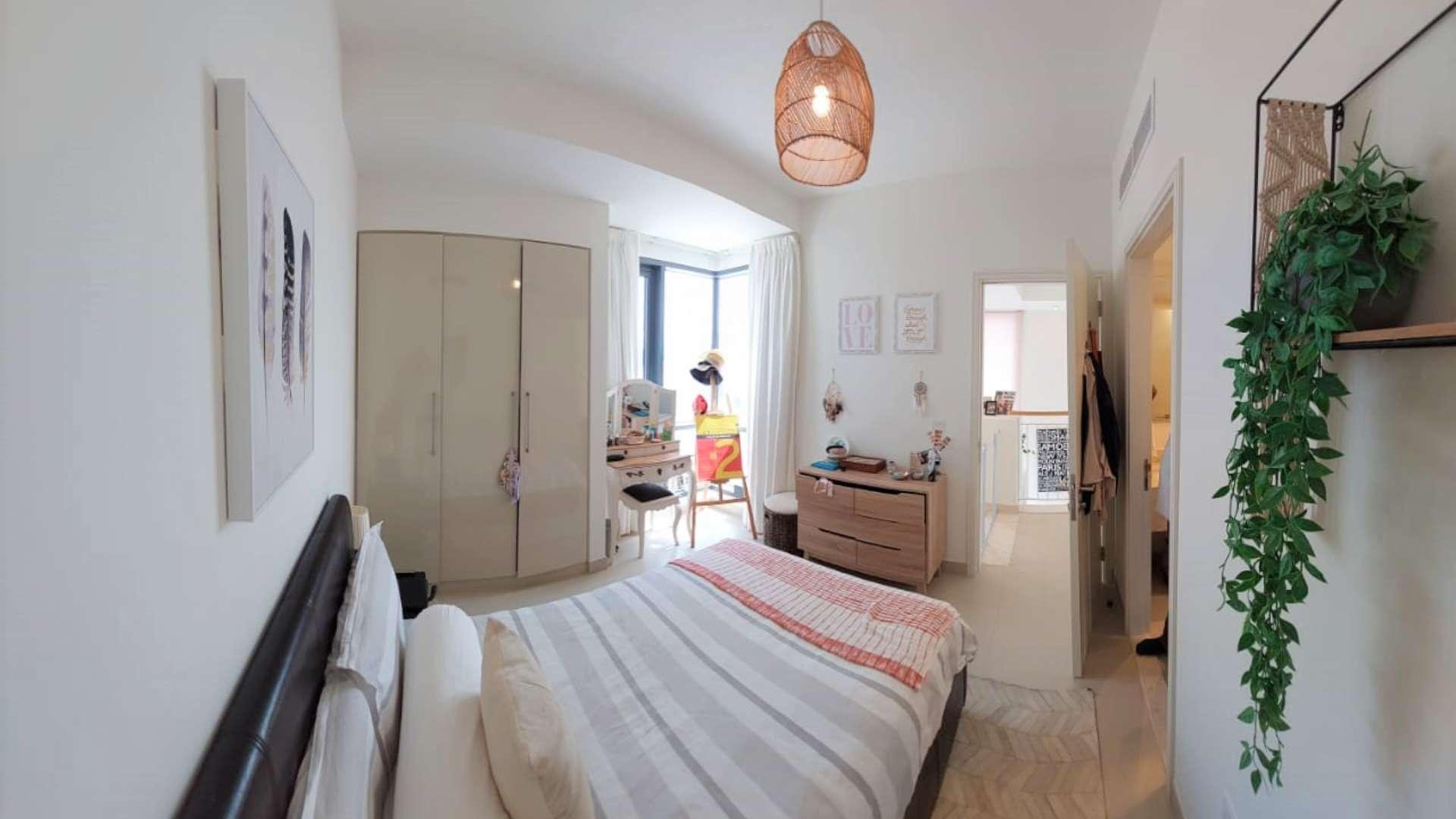 Modern living room in upgraded townhouse, Dubai Hills Estate, Maple. Bright space with balcony access