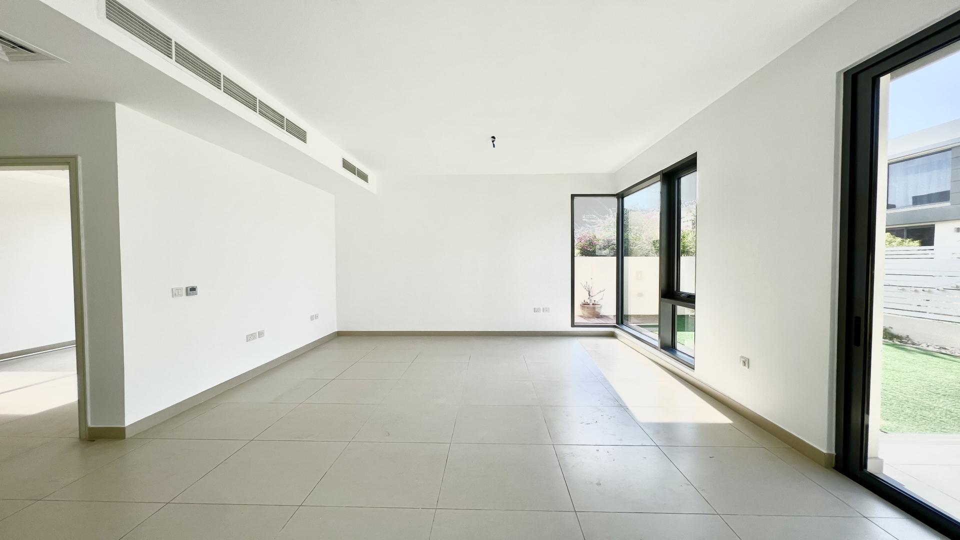 Spacious living room with large windows in 4-bedroom villa, Maple, Dubai Hills Estate