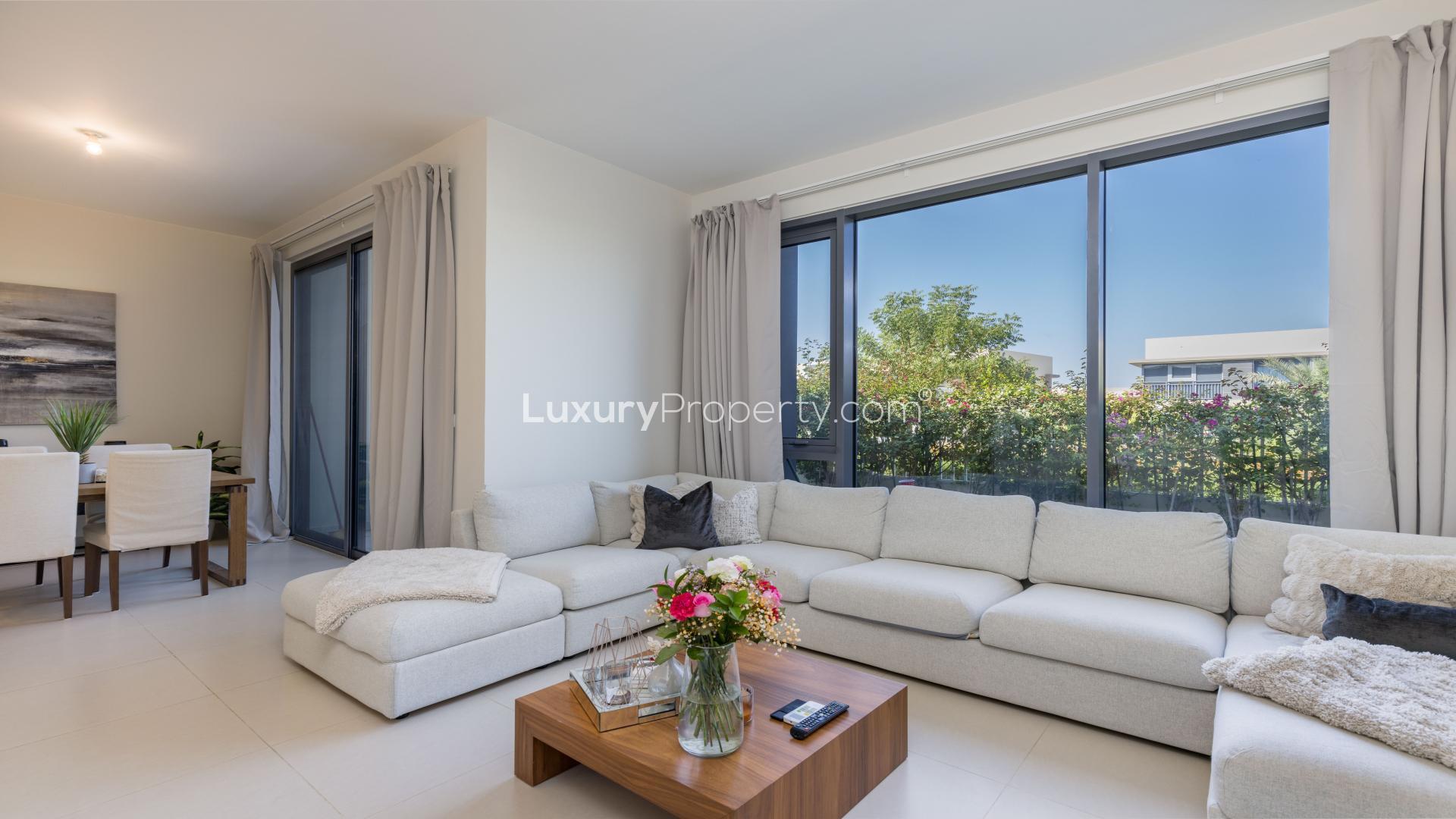 Luxurious villa exterior in Maple at Dubai Hills Estate, surrounded by lush greenery