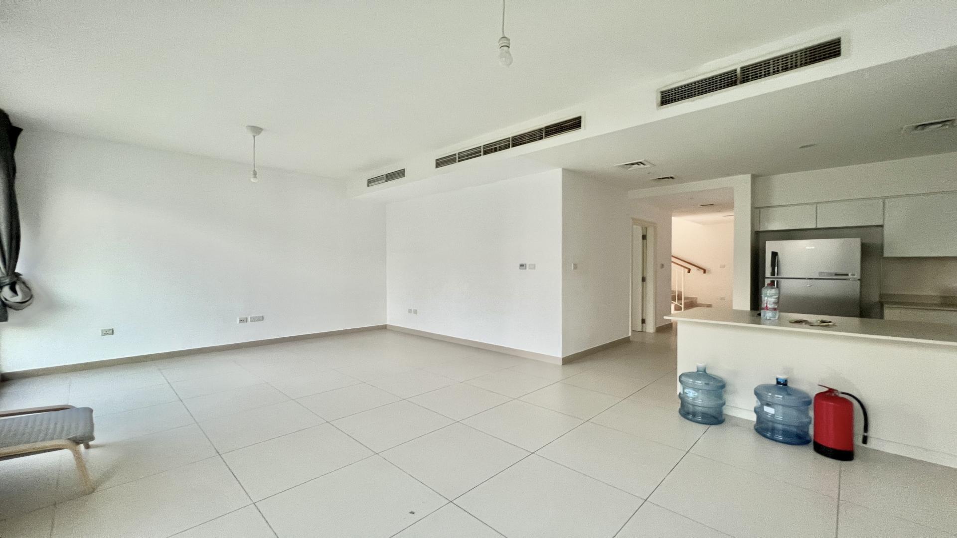 Bright living area with large windows in Dubai Hills Estate villa for rent