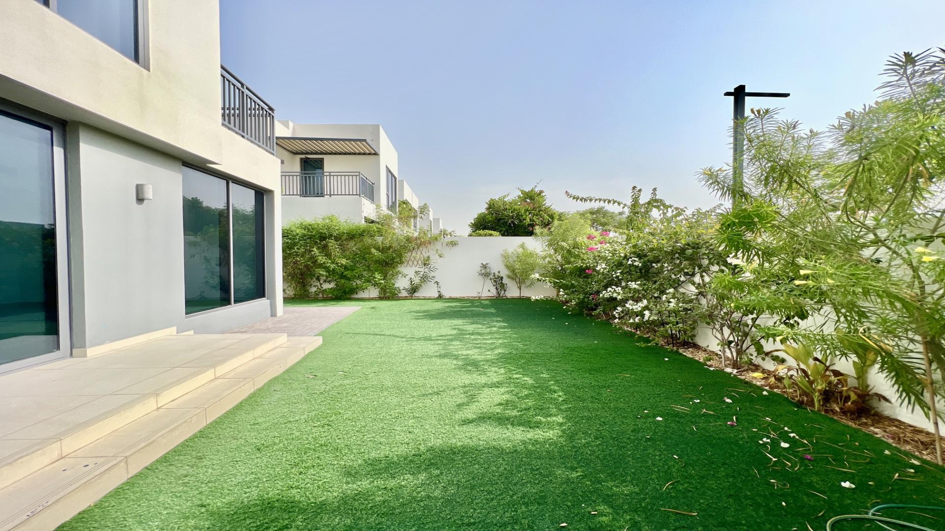 Modern 4-bedroom villa exterior with garden in Maple, Dubai Hills Estate for rent