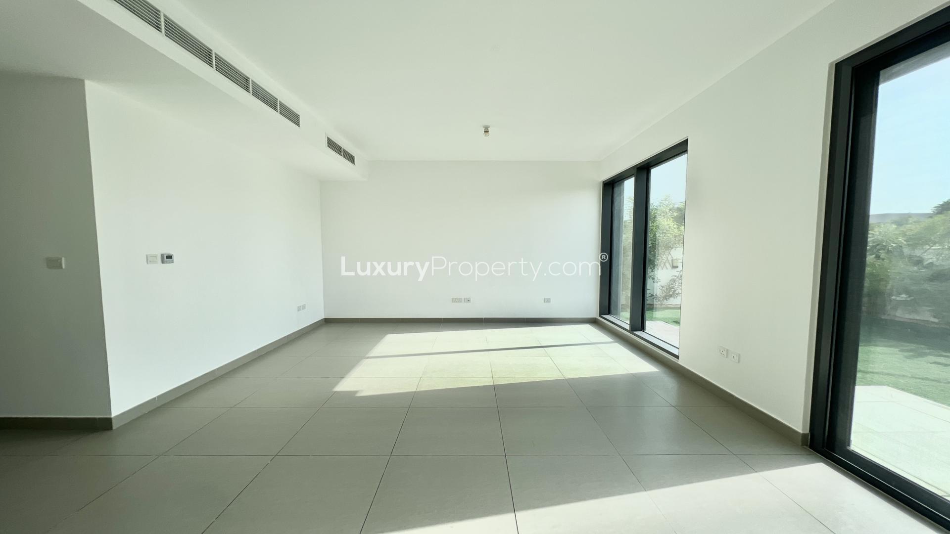 Spacious living room with large windows in 4-bedroom villa, Dubai Hills Estate, Maple 3