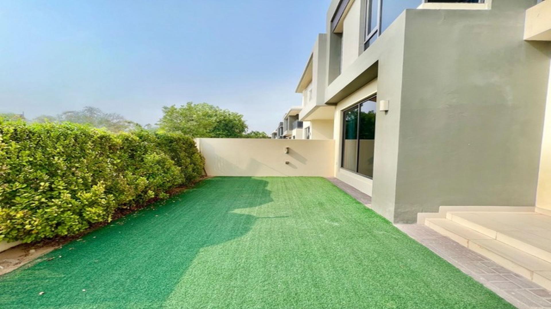Bright 4-bedroom villa exterior with garden in Maple 1, Dubai Hills Estate