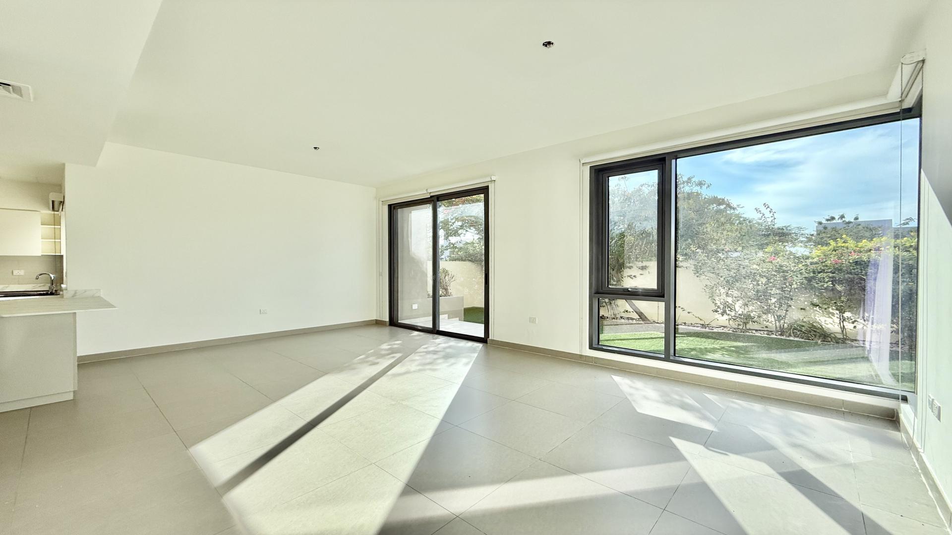 "Spacious garden view of upgraded 4-bedroom villa in Maple 2, Dubai Hills Estate.","Spacious living area with large windows in Maple 2 villa, Dubai Hills Estate.","Bright, spacious living area in upgraded 4-bedroom villa, Maple 2, Dubai Hills Estate.",Bright, spacious living area in upgraded 4-bedroom villa, Dubai Hills Estate, Maple 2