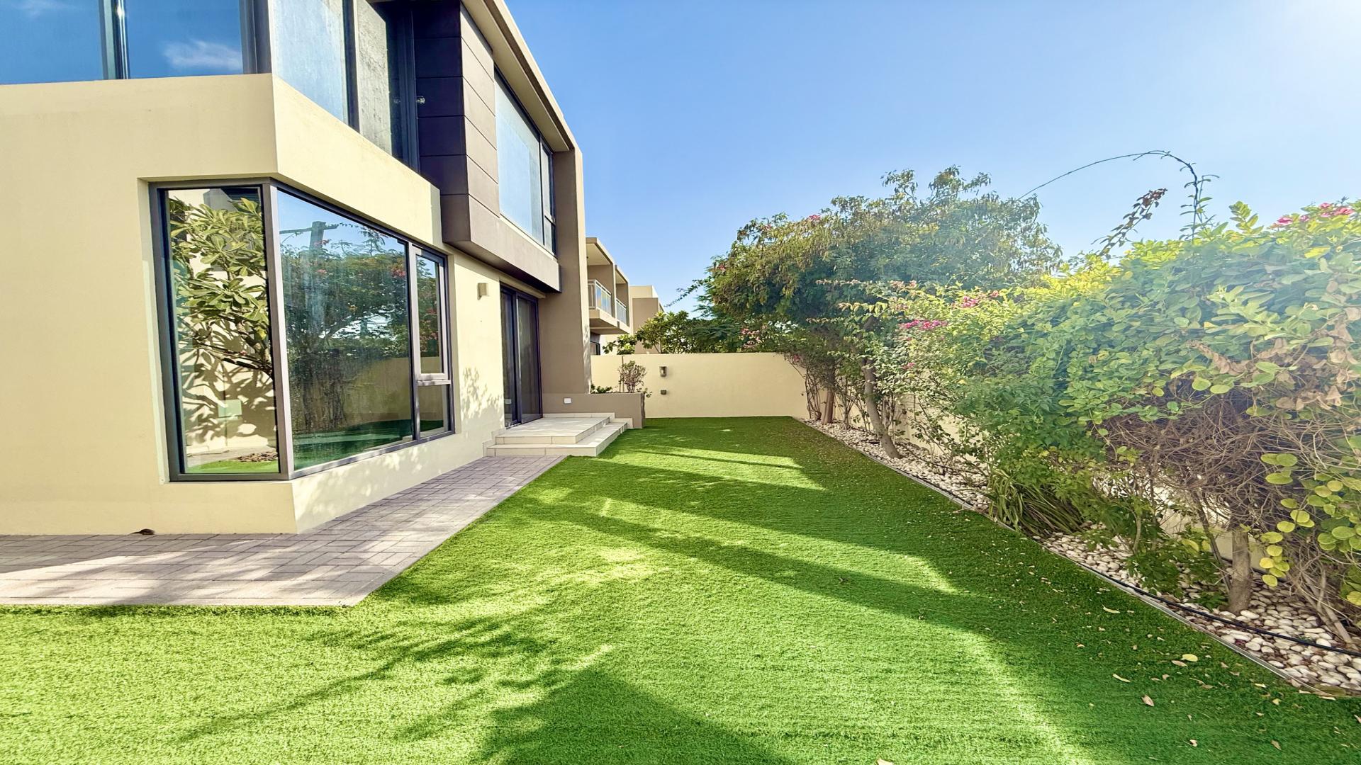 Upgraded 4-bedroom villa exterior in Maple 2, Dubai Hills Estate, single row, lush garden