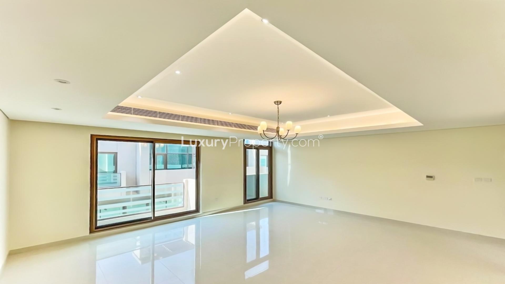 Modern townhouse patio with artificial grass in Meydan Gated Community, perfect for relaxation