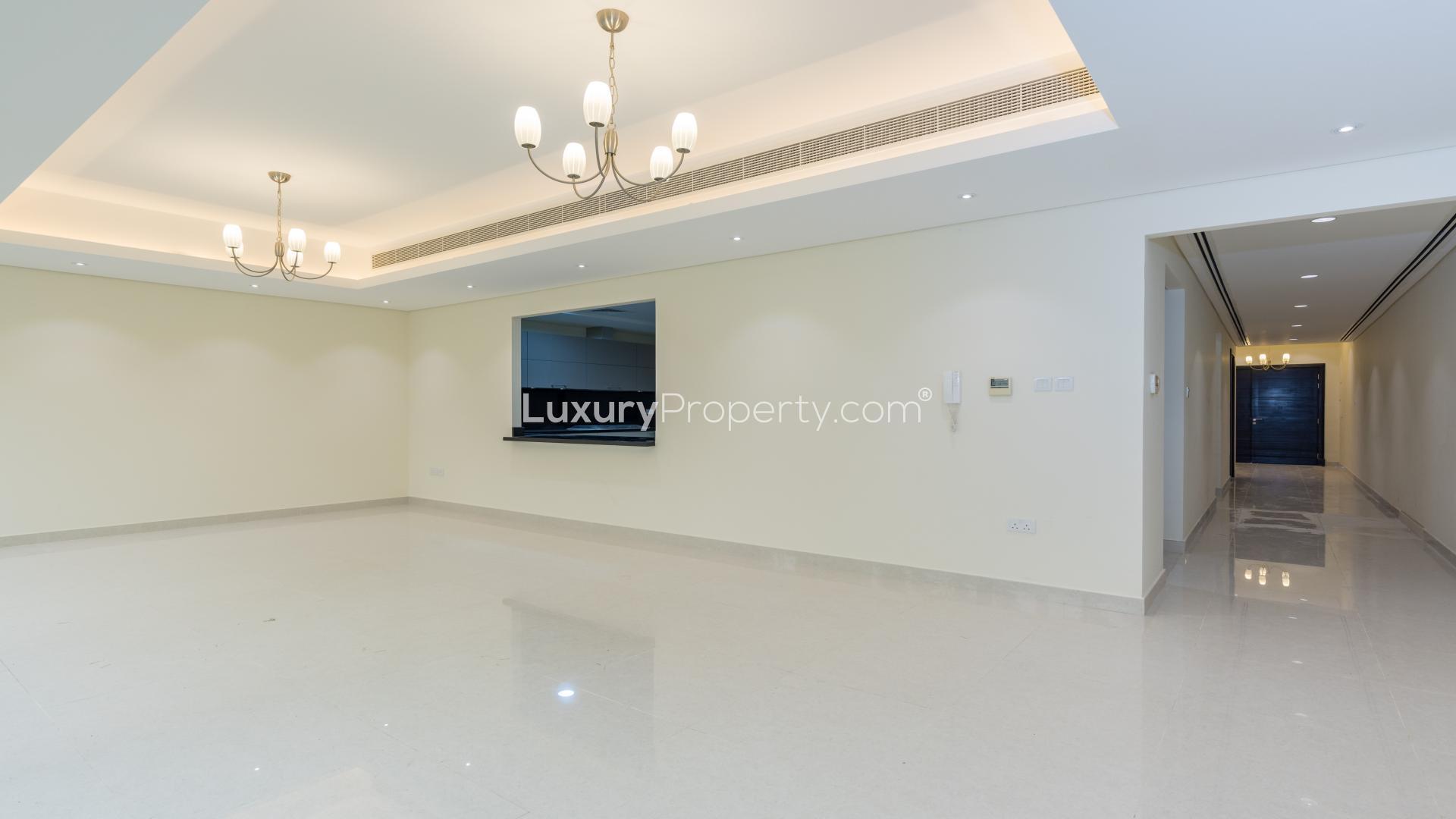 Contemporary Meydan City townhouse with private garden, large windows, and modern exterior design