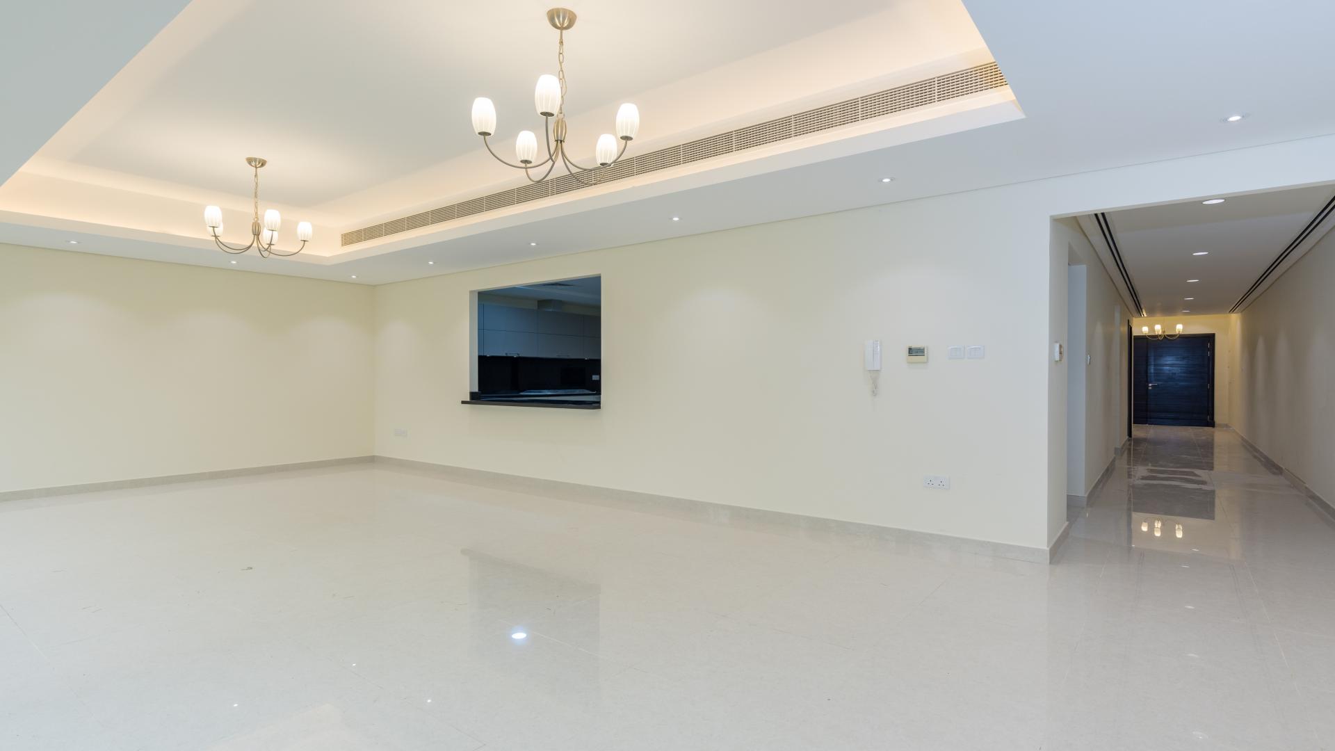 Contemporary Meydan City townhouse with private garden, large windows, and modern exterior design