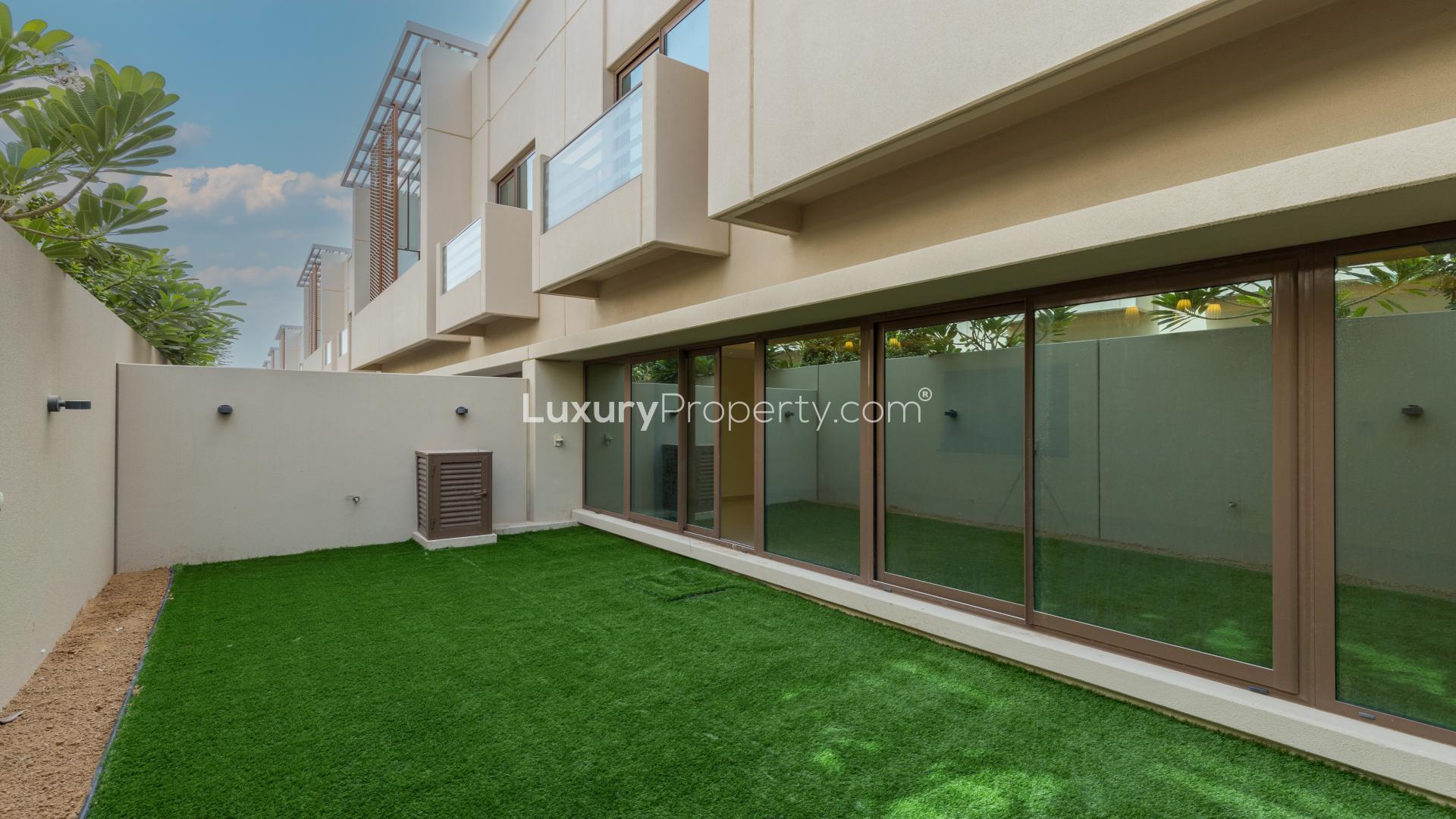 Spacious living area with large windows in Meydan City townhouse for rent