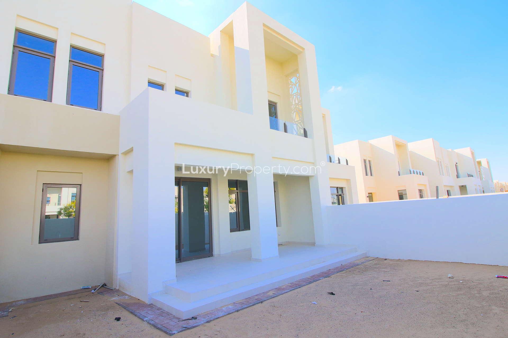 Empty room with large windows in Mira Oasis 3 townhouse, Reem community