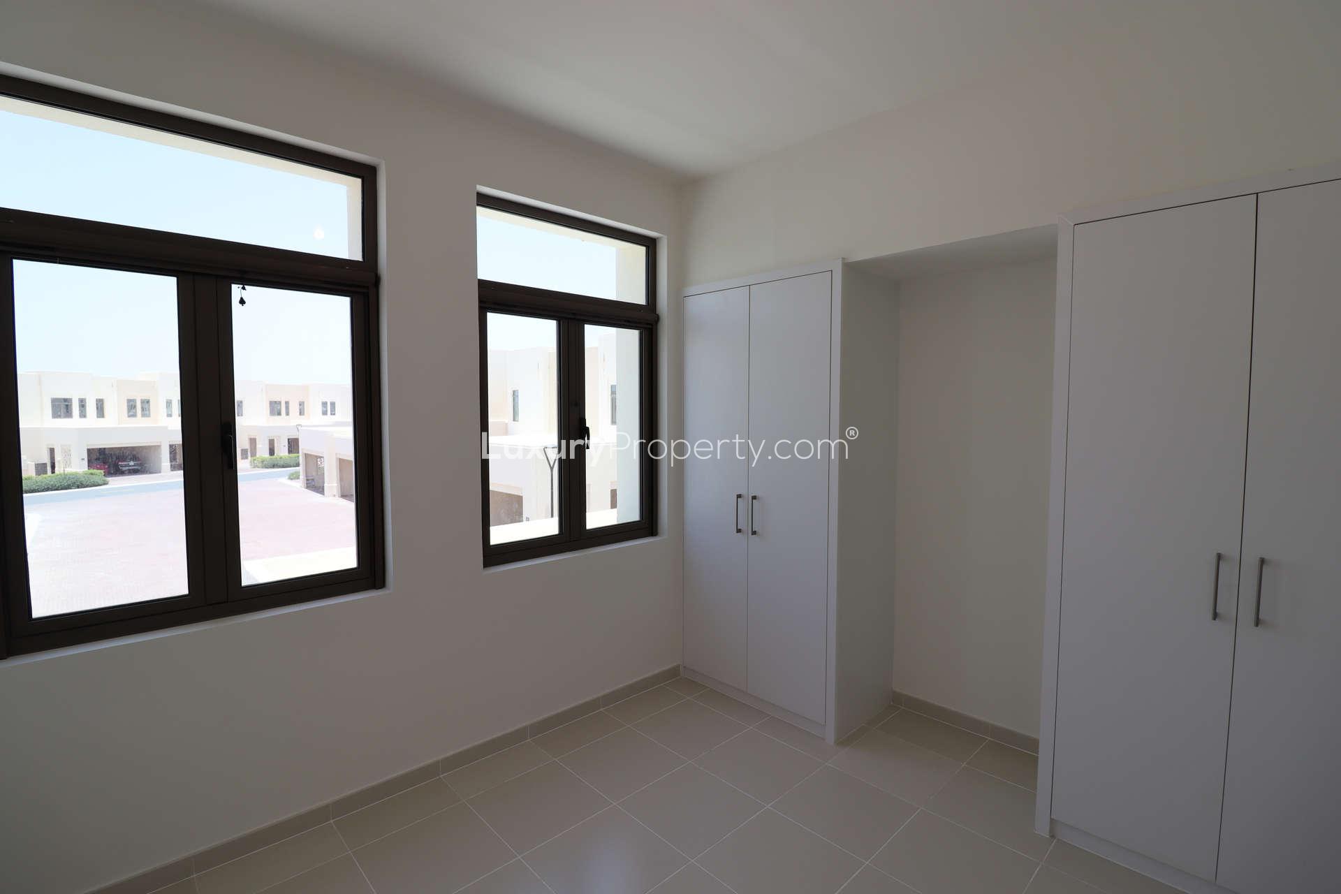 Brand new Mira Oasis townhouse bedroom with wardrobe and large windows, Reem community