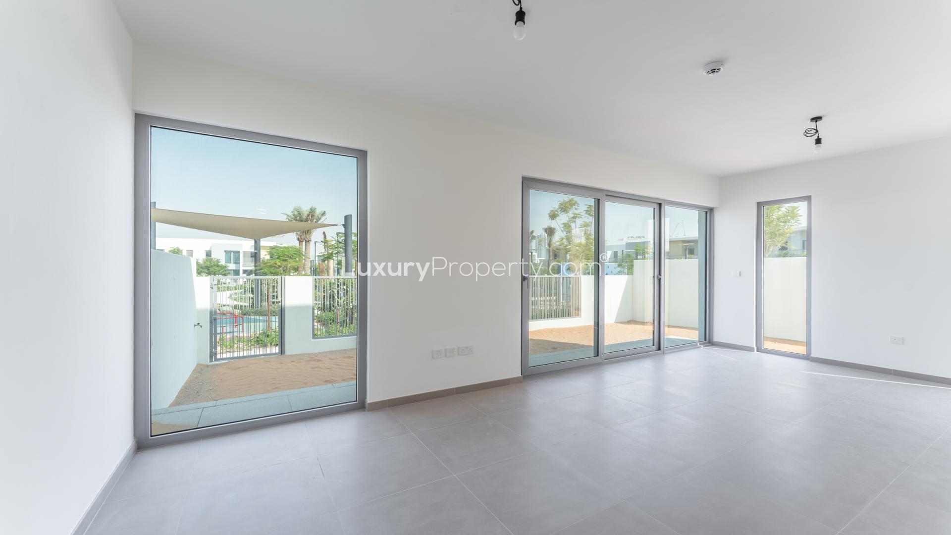 Modern 4-bedroom townhouse exterior in Elan, Tilal Al Ghaf community, available for rent