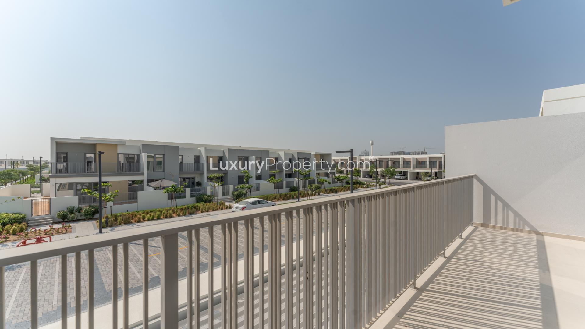Spacious living room with large windows in Elan townhouse, Tilal Al Ghaf community