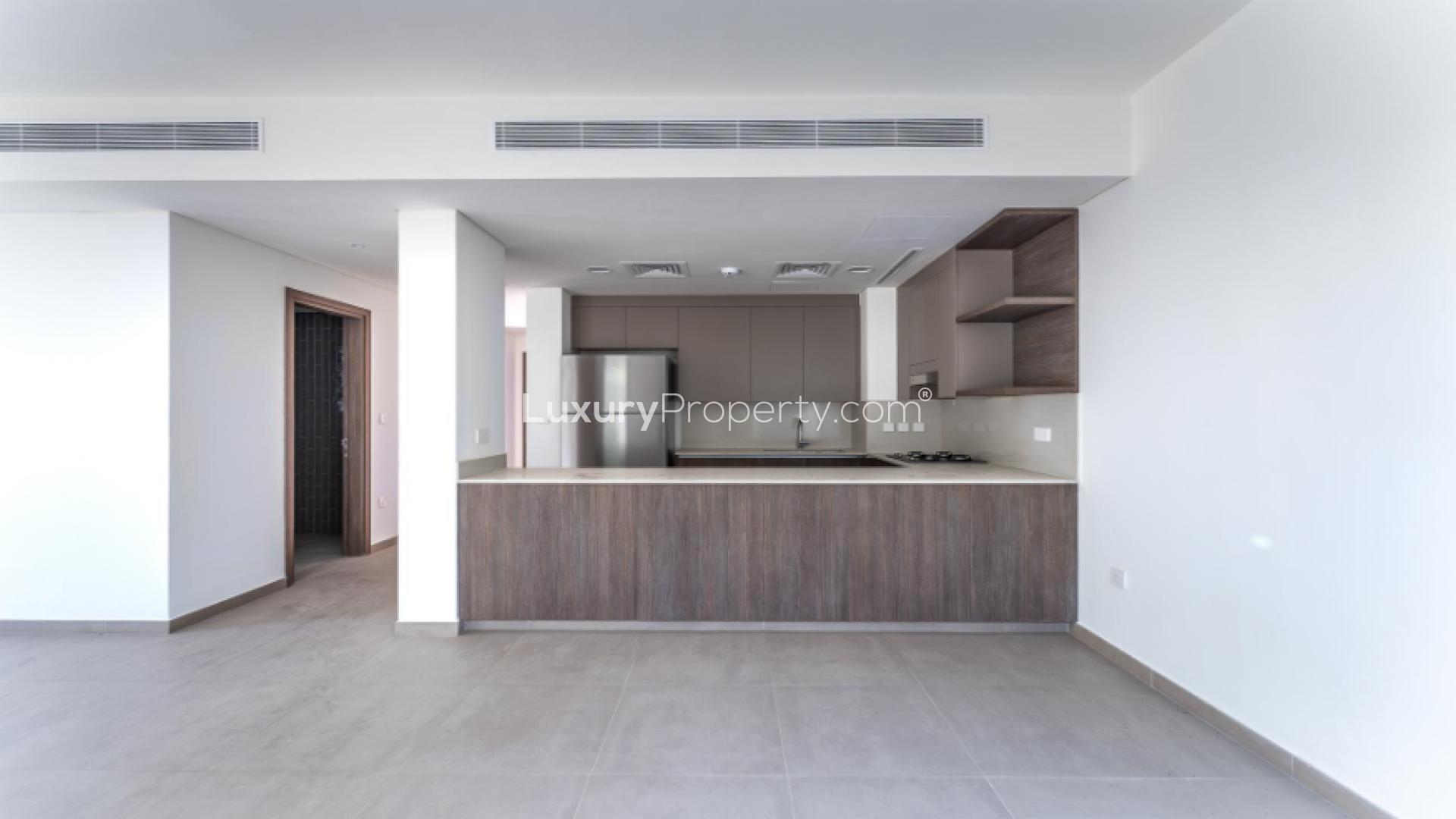 Modern kitchen and living area in Tilal Al Ghaf Elan townhouse for rent