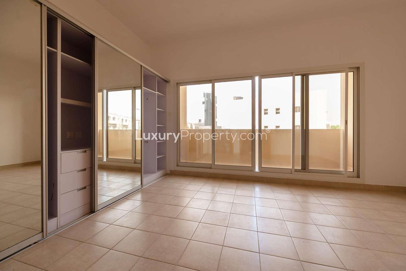 "Modern staircase in 4-bedroom townhouse for rent, Mulberry Park, Jumeirah Village Circle.",Spacious bedroom with built-in wardrobe and large windows in JVC townhouse for rent