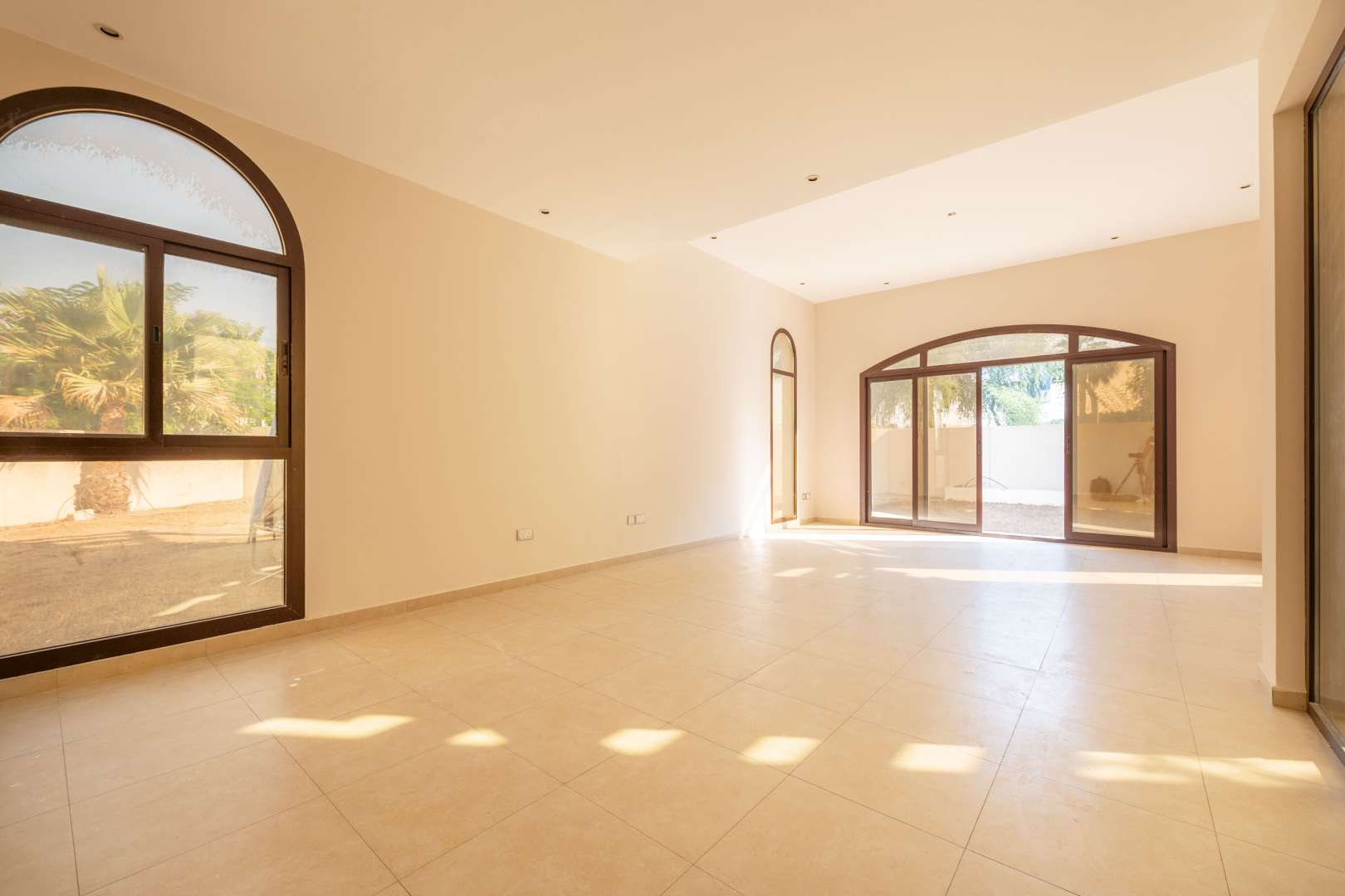 Spacious living area in four-bedroom townhouse for rent, Al Naseem, Mudon