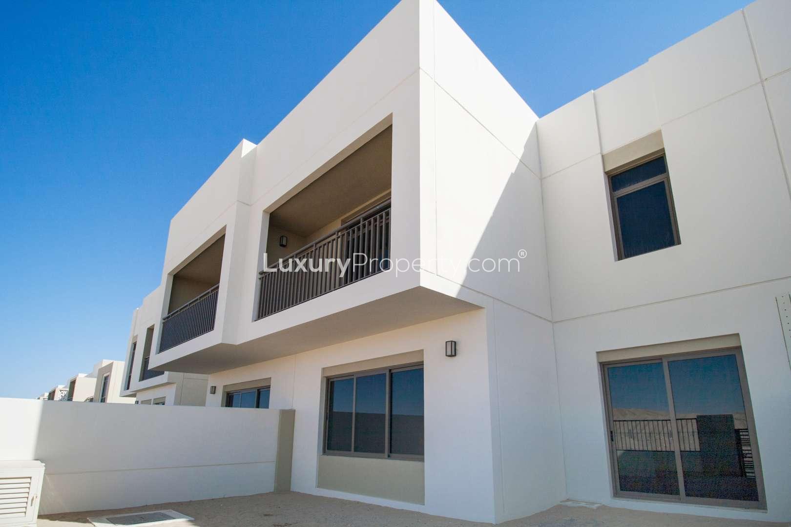 Corner townhouse exterior in Naseem, Town Square, featuring modern architecture and spacious balconies