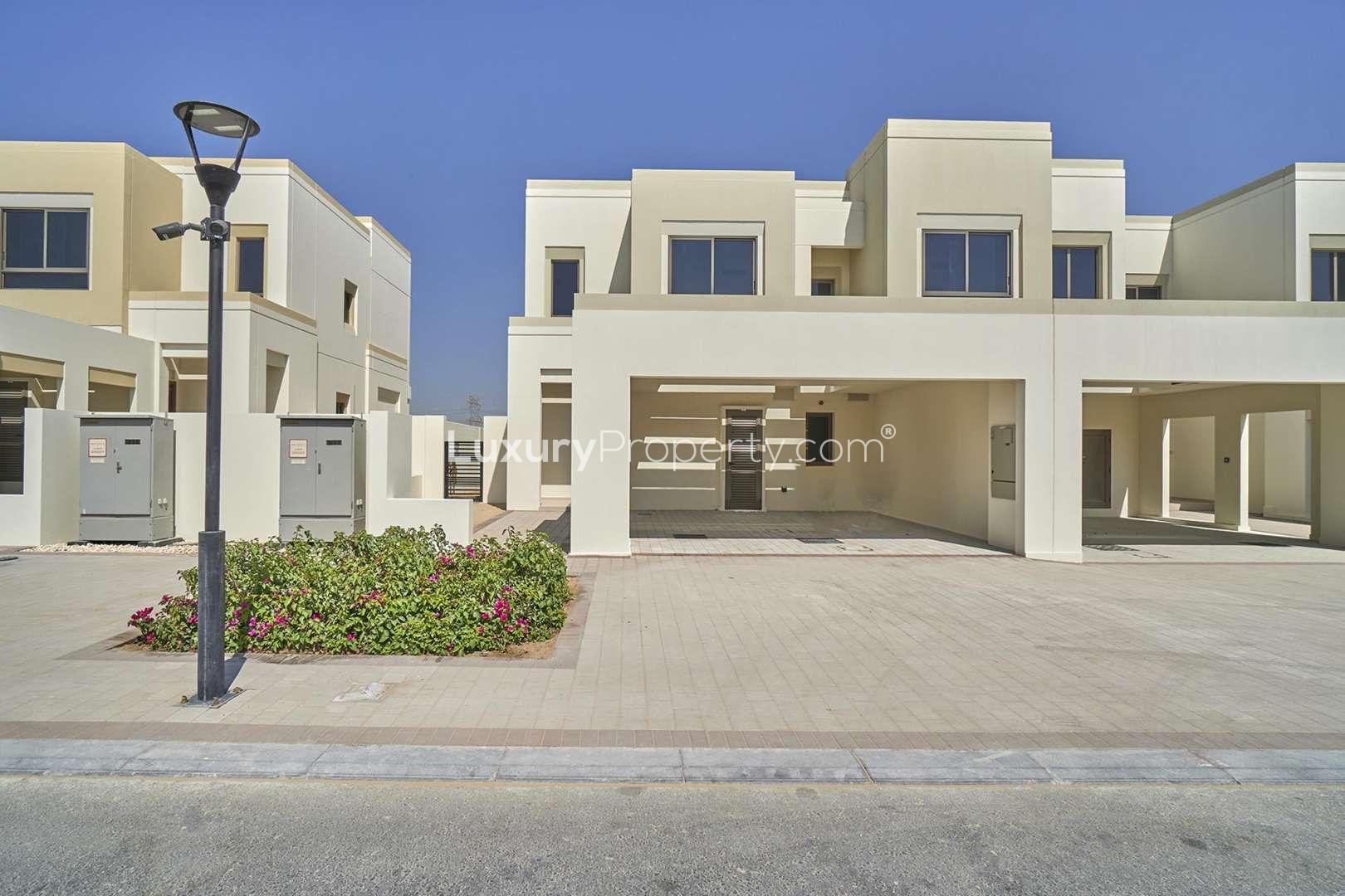 Empty bedroom with built-in wardrobe in Naseem Townhouses, Town Square rental property